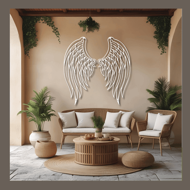 Decorative wall art with angel wings in a living room setting.