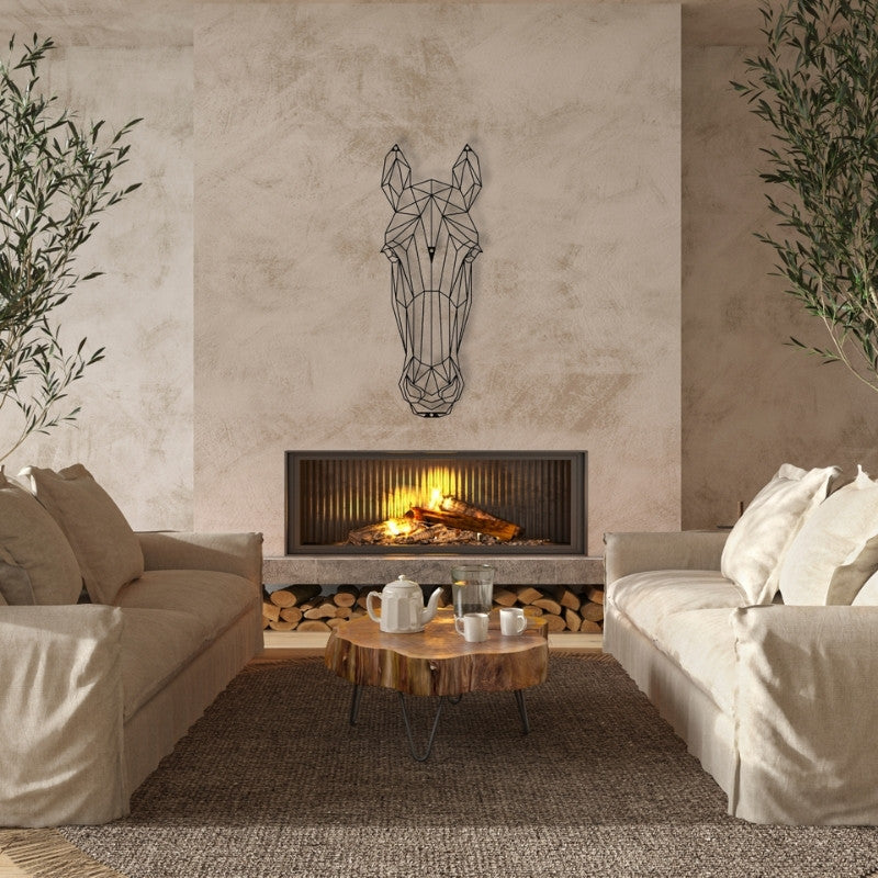 geometric horse head metal wall art above a modern fireplace with a roaring fire and two matching neutral couches. The room is decorated with a rustic coffee table, a shaggy rug, and large potted plants. Art on Steel