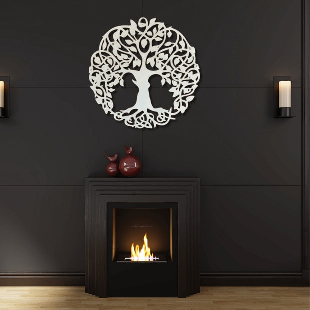 White Celtic Tree of Life metal wall art above modern black fireplace – handcrafted steel décor for living room, symbolic family tree artwork by Art on Steel, South Africa.