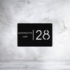 Modern custom steel house number sign – House Number AOS10 by Art on Steel. Features bold number '28' with street name 'Washington Way' in a minimalist black powder-coated steel design. Durable, weather-resistant, and precision laser-cut house number plate for contemporary curb appeal in South Africa