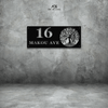 A custom house number sign featuring the number 16 and the text 'MAKOU AVE' mounted on a grey wall. The sign has a steel art design with a tree motif.