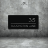 Modern custom steel house number sign – House Number AOS9 by Art on Steel. Features bold street address '35 Bulkington Lane' in minimalist black powder-coated steel design. Durable, weather-resistant, and precision laser-cut house number plate for stylish curb appeal in South Africa