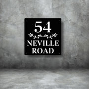 Custom black steel house number sign with bold number 54 and Neville Road text – modern laser-cut metal address plaque with decorative leaf design, weatherproof and stylish home signage by Art on Steel, South Africa.