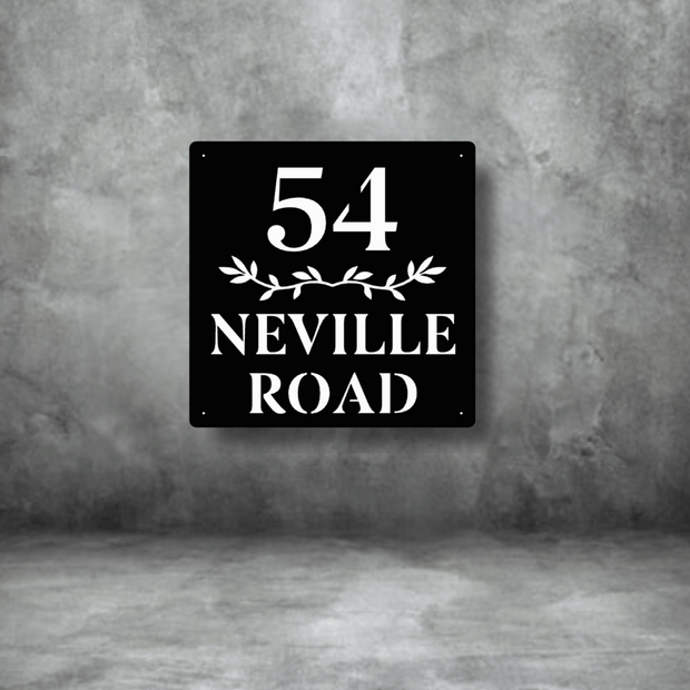 Black square sign with white text '54 Neville Road' on a gray concrete background