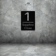 Black steel house number sign with modern cut-out design — number 1 and Sapphire Close text, minimalist rectangular plaque for outdoor wall mounting, durable metal address sign by Art on Steel, stylish home entrance décor in South Africa