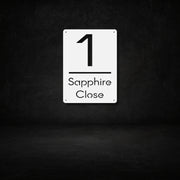 White steel house number sign with modern cut-out design — number 1 and Sapphire Close text, minimalist vertical address plaque for outdoor wall mounting, durable metal home entrance décor by Art on Steel, perfect for South African houses.