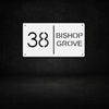 White steel house number sign with modern cut-out design — number 38 and Bishop Grove text, sleek horizontal metal address plaque by Art on Steel, durable outdoor wall-mounted décor for stylish South African homes.